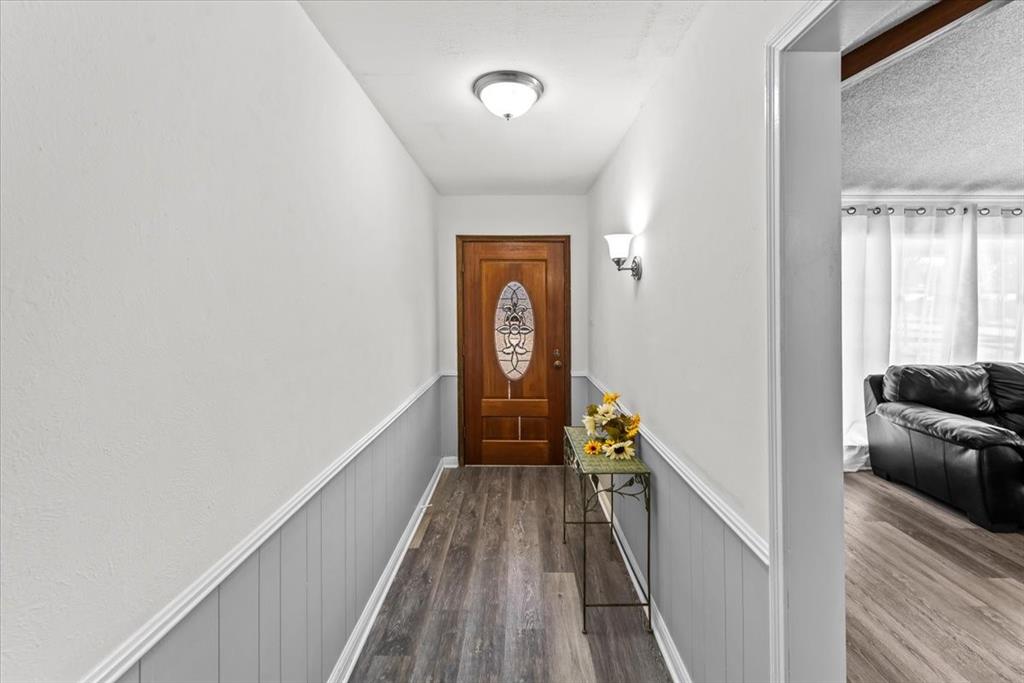 9313 Tree Lake Drive Waco, TX 76708 - Photo 6 of 35 a view of a hallway view with wooden floor and staircase