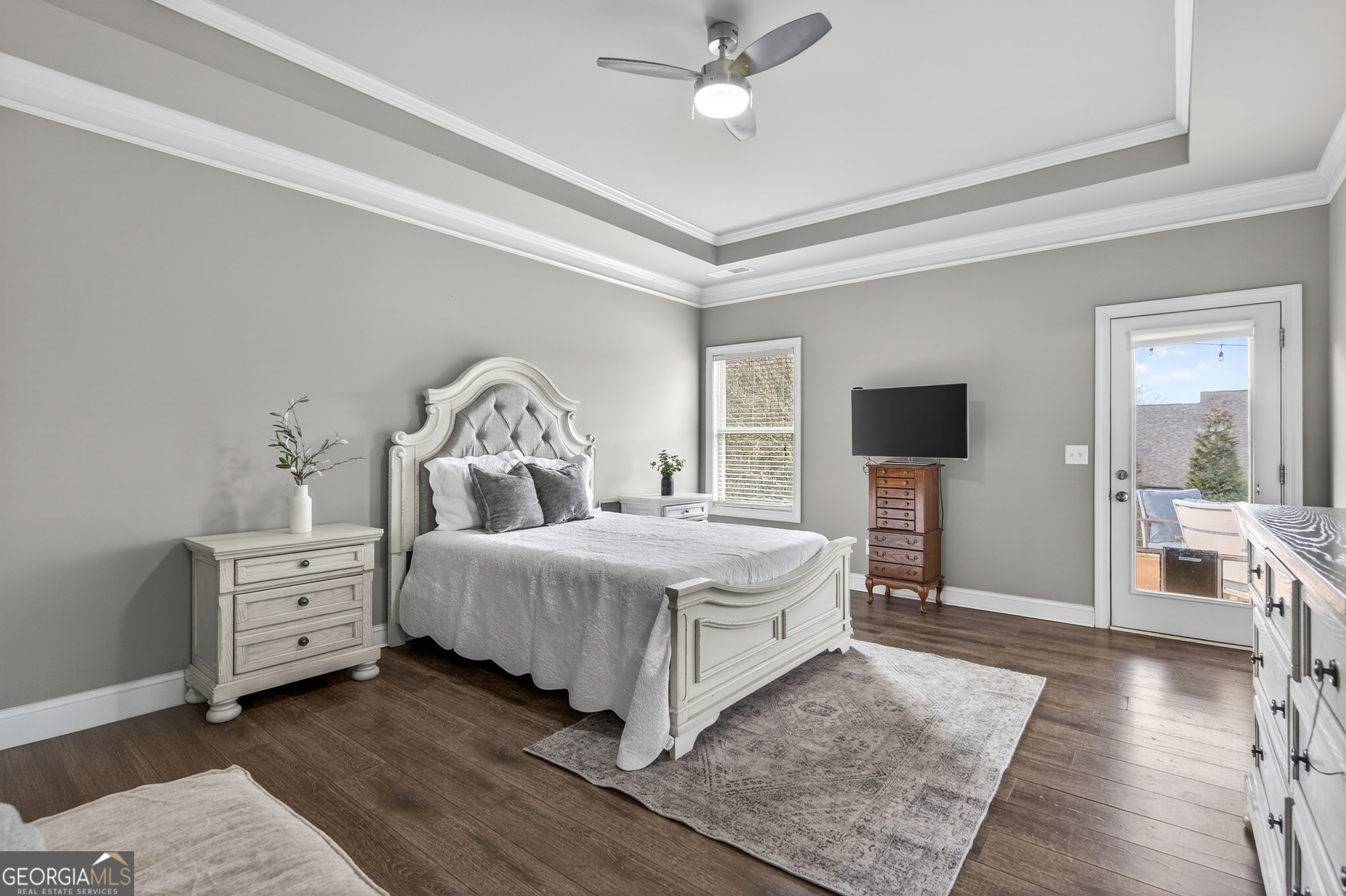 4772 Fairways Lane Jefferson, GA 30549 - Photo 13 of 56 a bedroom with a bed and a flat tv screen on dresser