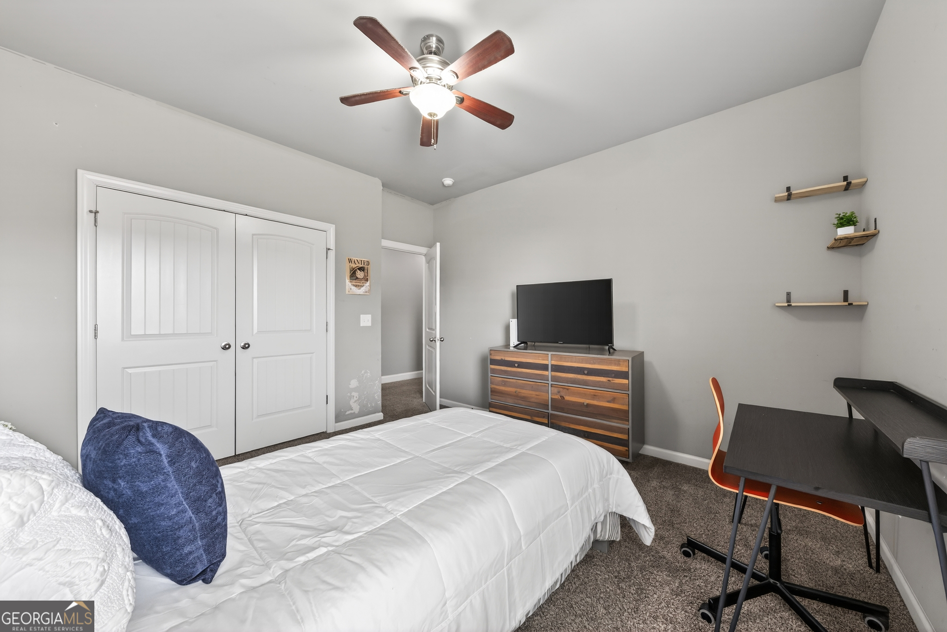 4772 Fairways Lane Jefferson, GA 30549 - Photo 18 of 56 a bedroom with a large bed and a chair