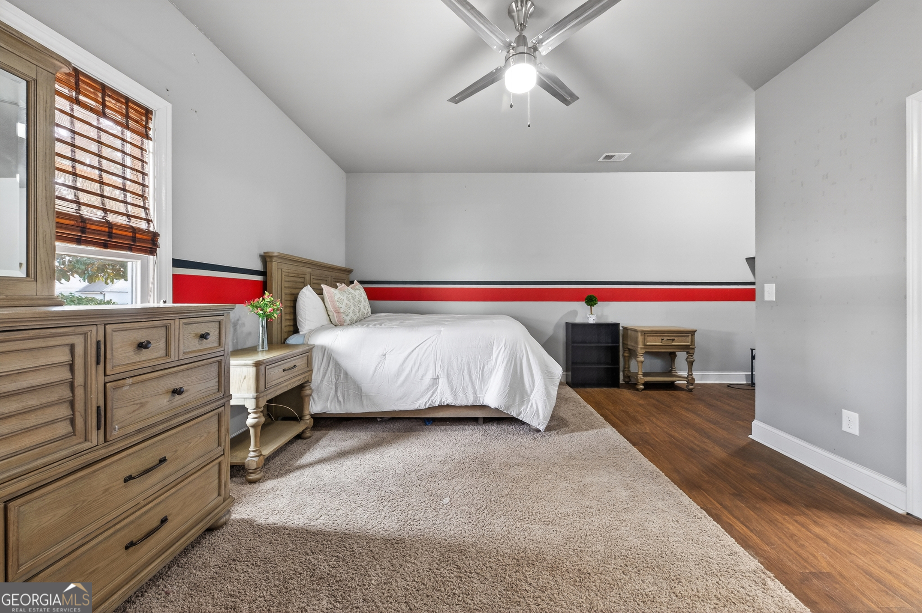 4772 Fairways Lane Jefferson, GA 30549 - Photo 21 of 56 a bedroom with a bed and a chandelier