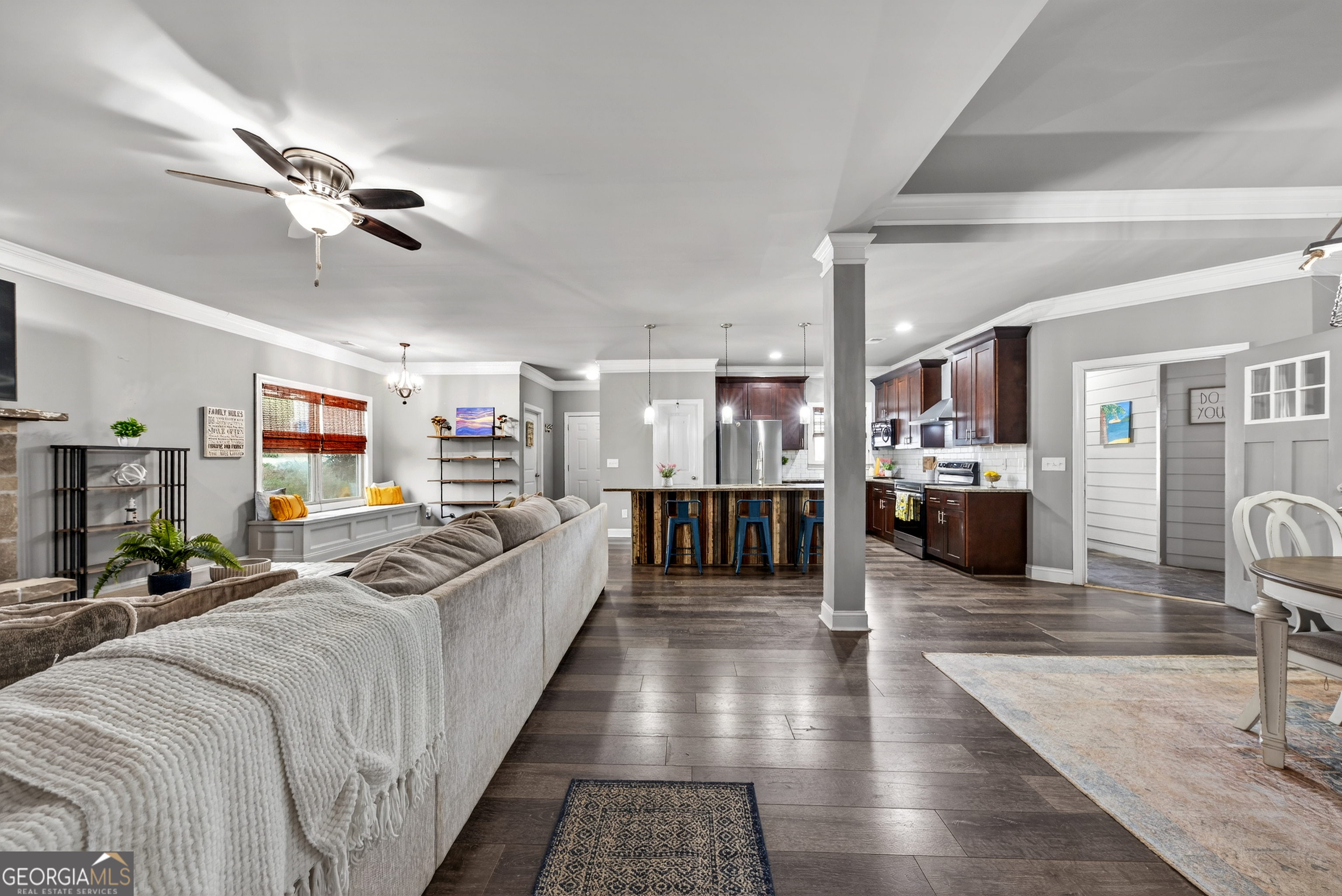 4772 Fairways Lane Jefferson, GA 30549 - Photo 28 of 56 a large living room with stainless steel appliances kitchen island granite countertop a large window and a view of living room