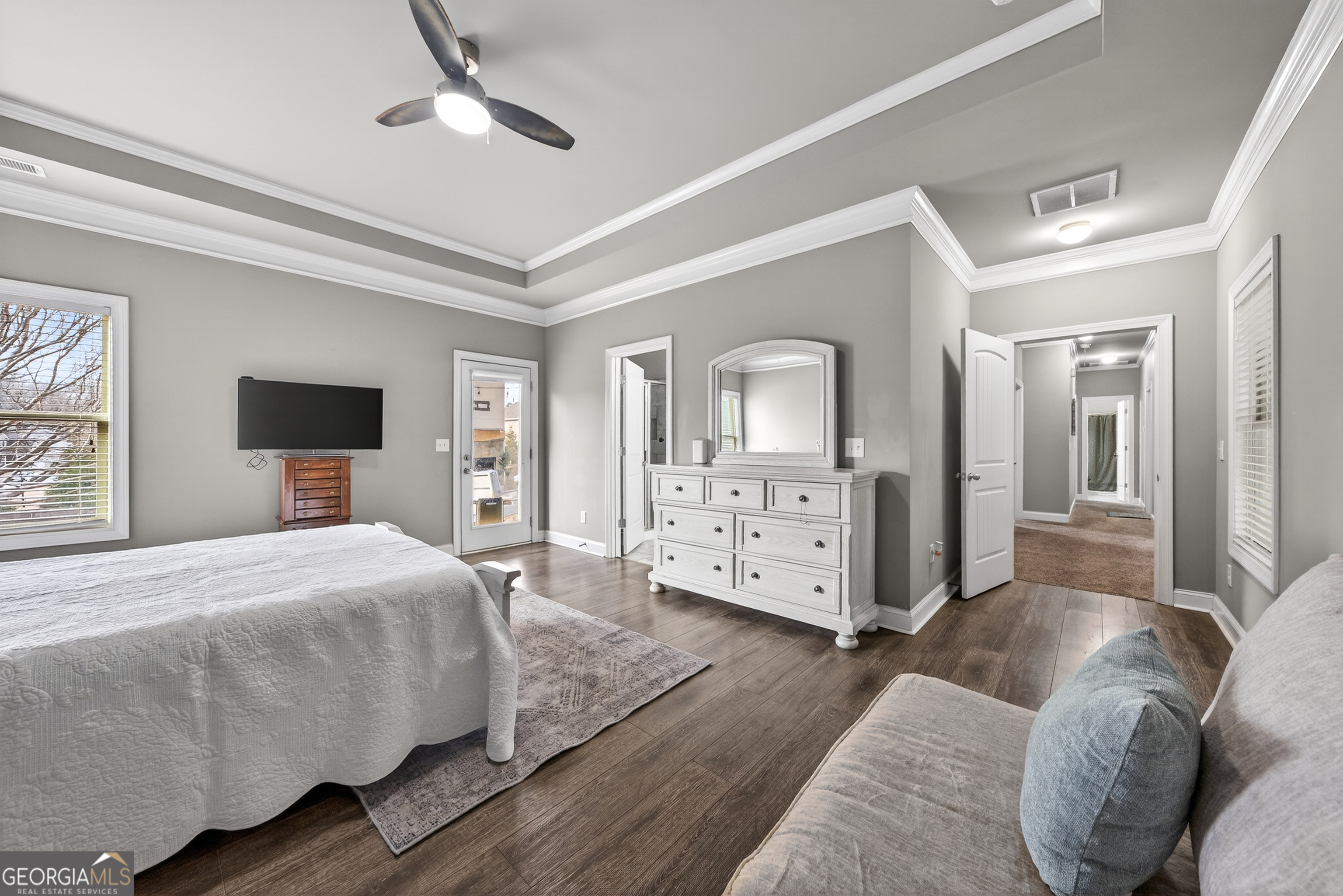 4772 Fairways Lane Jefferson, GA 30549 - Photo 37 of 56 a bedroom with a bed and wooden floor