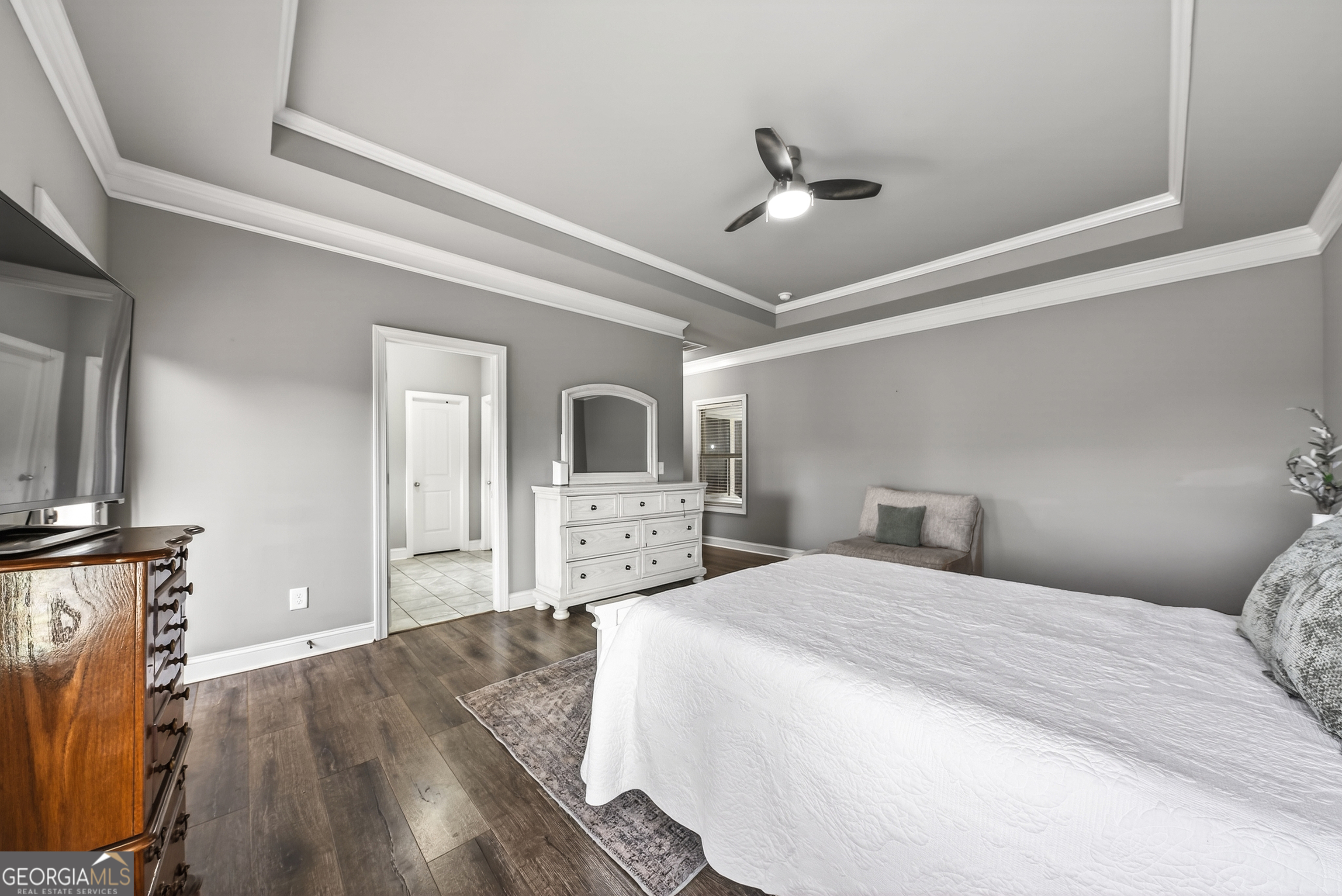 4772 Fairways Lane Jefferson, GA 30549 - Photo 38 of 56 a bedroom with a large bed and a flat tv screen on dresser