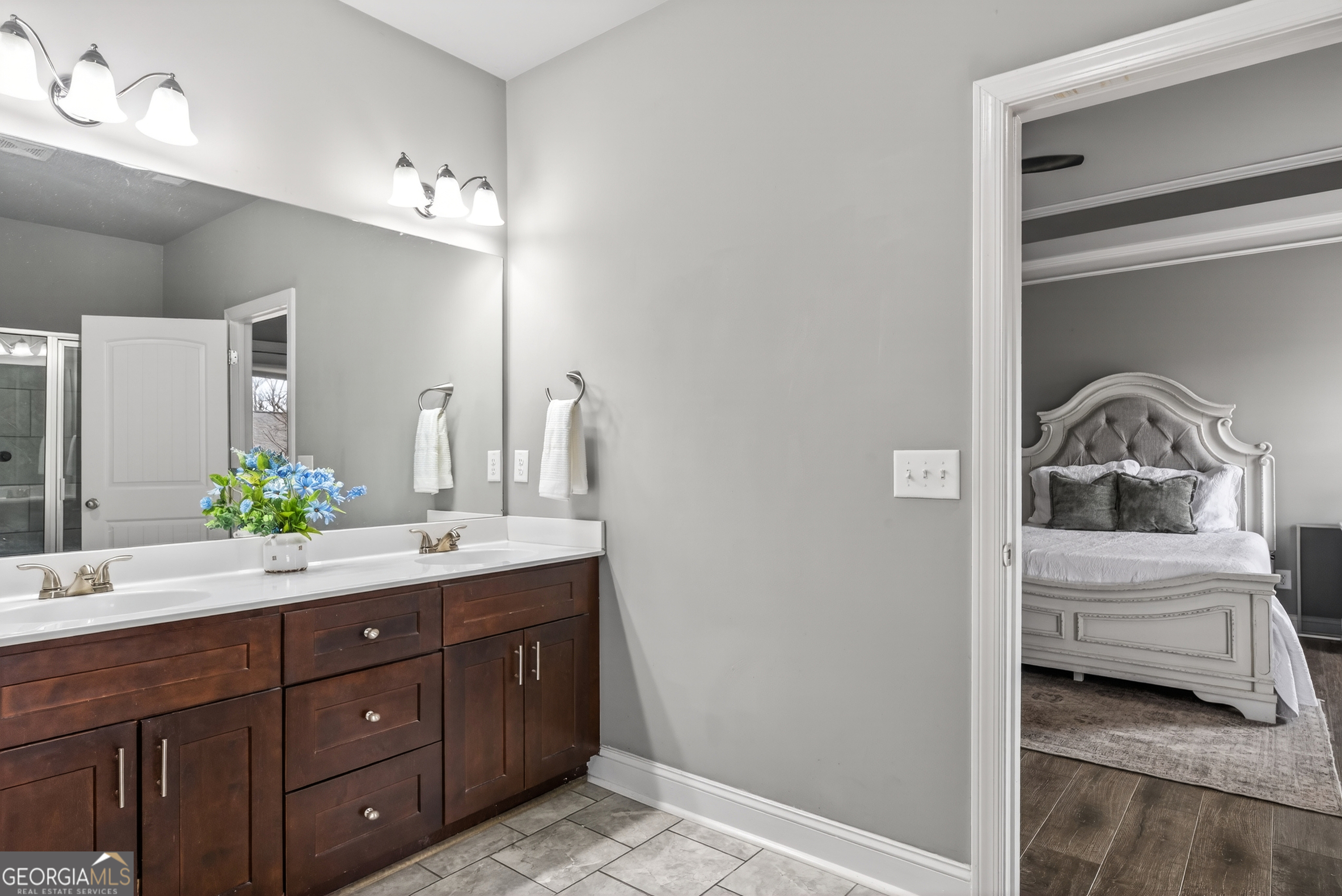 4772 Fairways Lane Jefferson, GA 30549 - Photo 39 of 56 a en suite bathroom with a double vanity sink and a mirror