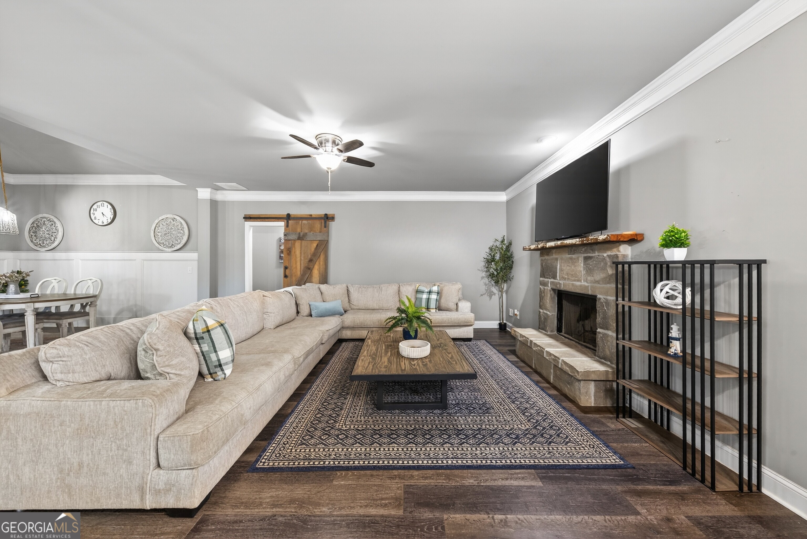 4772 Fairways Lane Jefferson, GA 30549 - Photo 4 of 56 a living room with furniture a flat screen tv and a fireplace