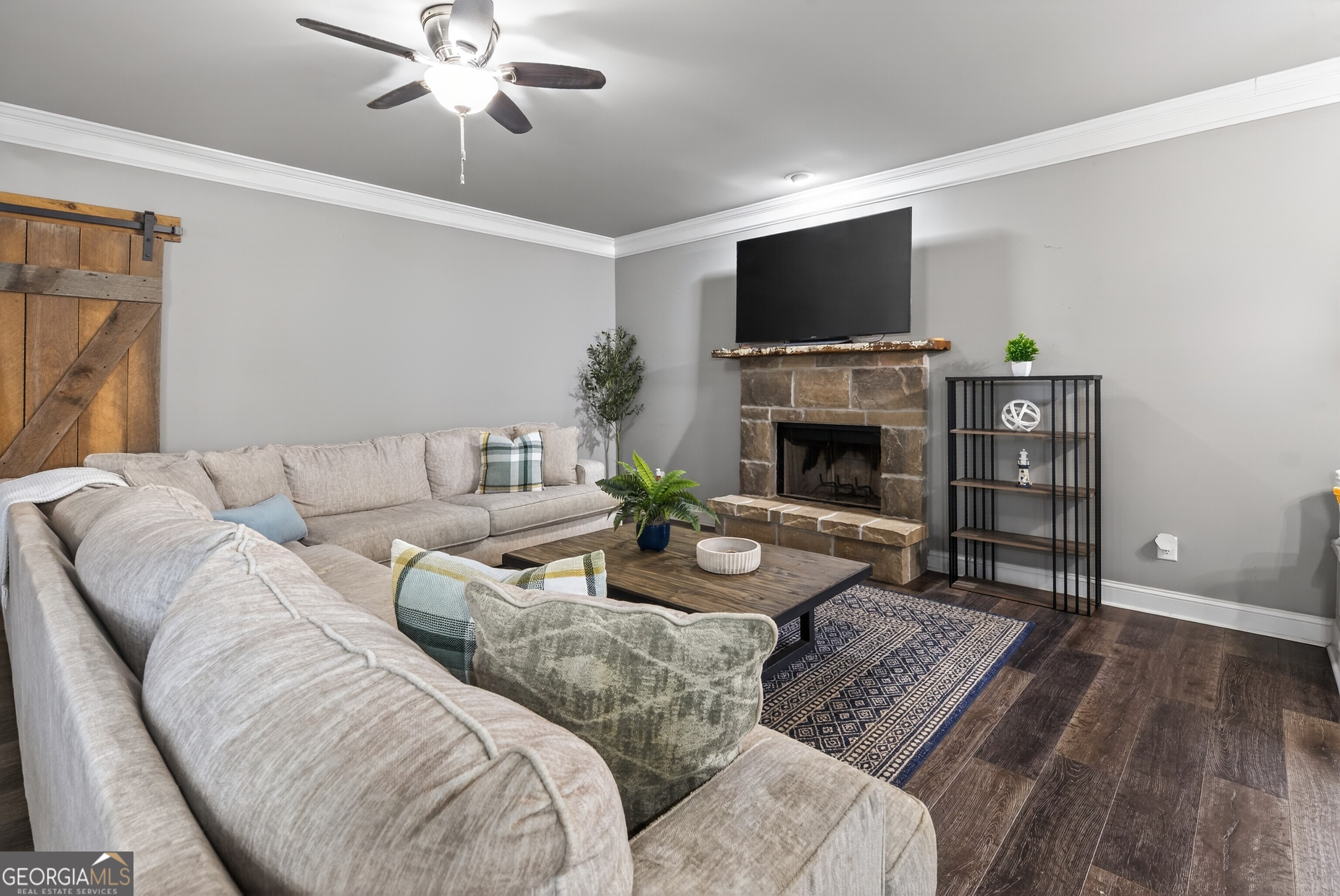 4772 Fairways Lane Jefferson, GA 30549 - Photo 5 of 56 a living room with furniture a fireplace and a flat screen tv