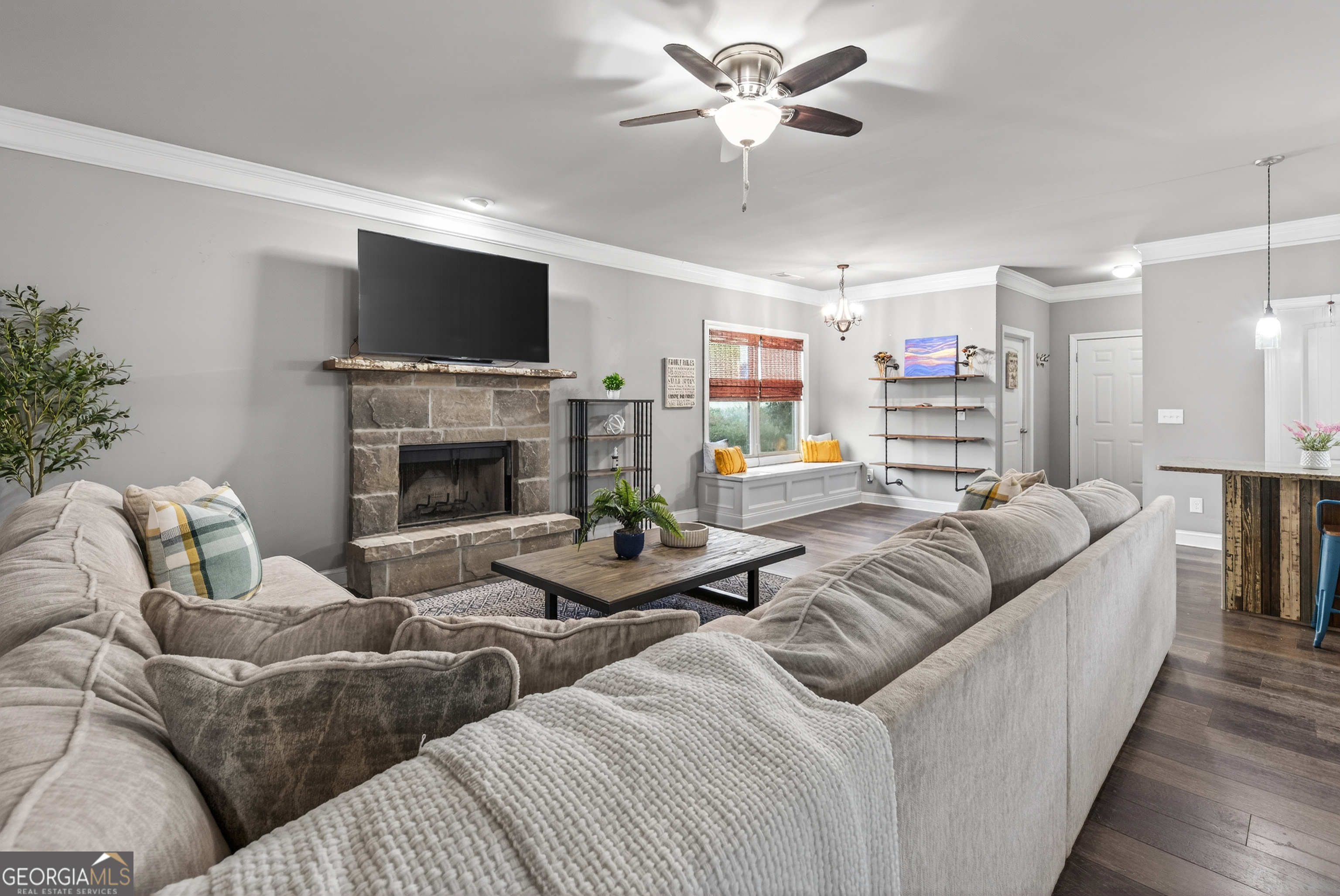 4772 Fairways Lane Jefferson, GA 30549 - Photo 6 of 56 a living room with furniture a flat screen tv and a fireplace