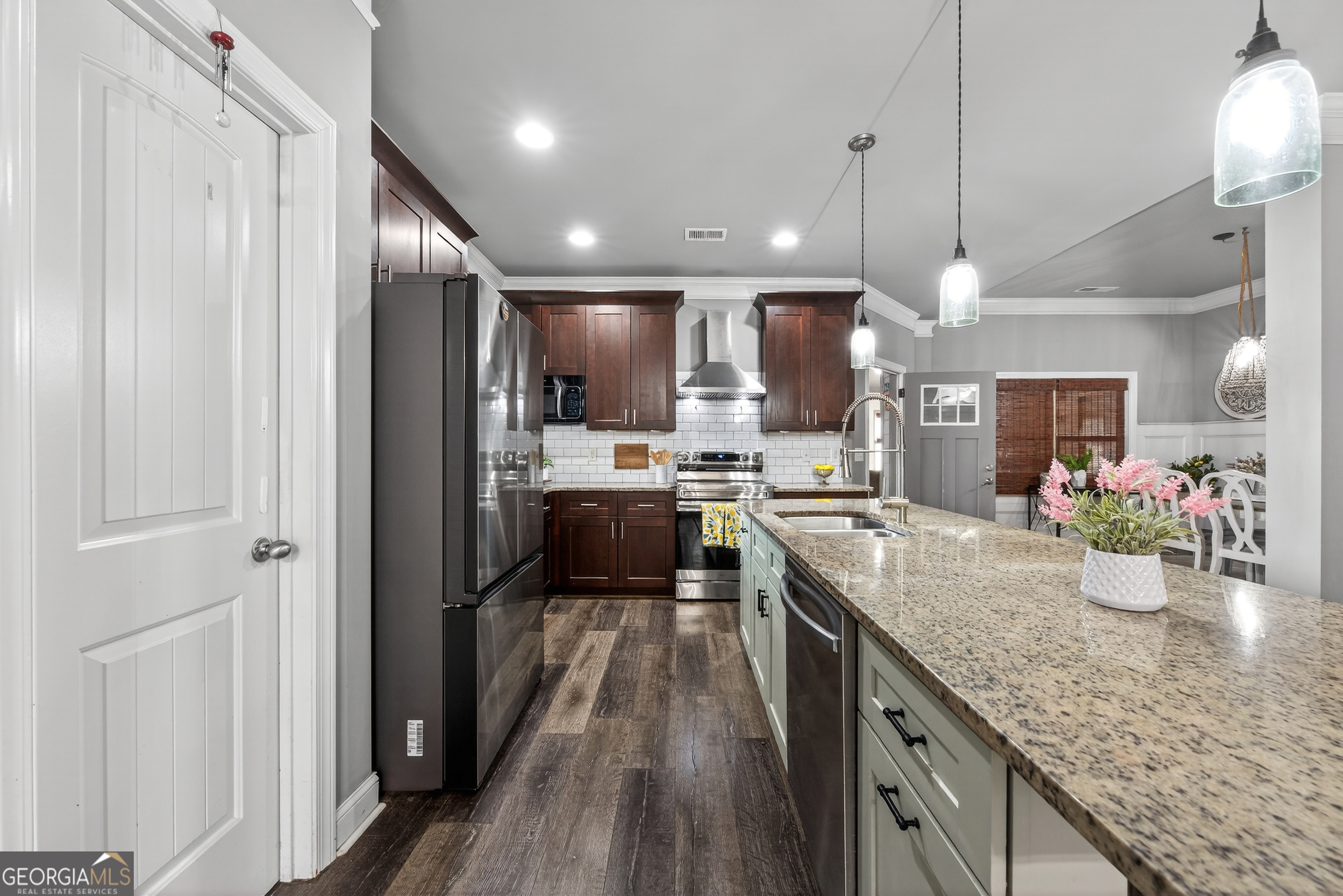 4772 Fairways Lane Jefferson, GA 30549 - Photo 8 of 56 a kitchen with stainless steel appliances granite countertop sink stove refrigerator and cabinets