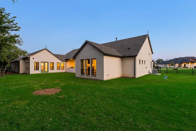 a aerial view of a house with a big yard