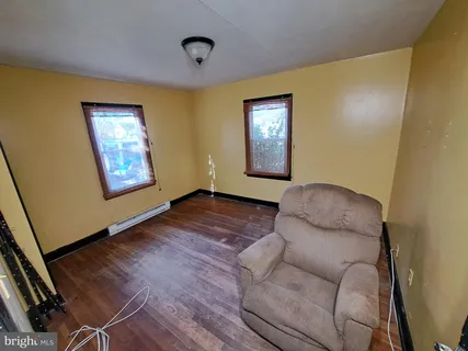 a room with furniture and gym equipment