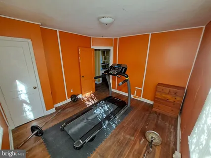 a white table sitting in a kitchen next to a window