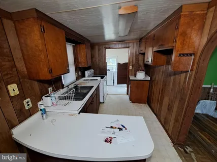 a bathroom with a shower and a sink