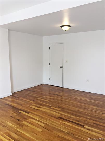 24-26 Academy Street, Unit 2 Poughkeepsie, NY 12601 - Photo 1 of 1 a view of an empty room and wooden floor