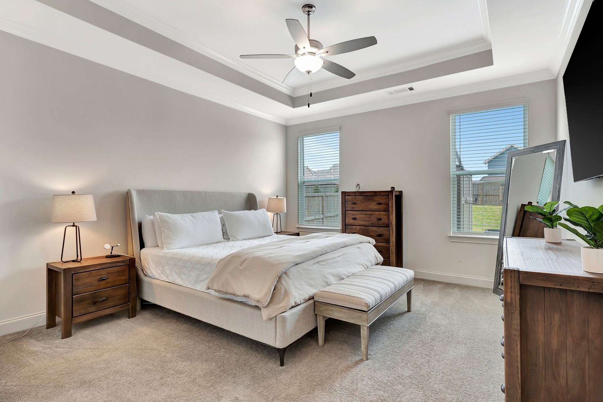 3017 Shandor St Spring Hill Spring Hill, TN 37174 - Photo 21 of 46 a spacious bedroom with a bed a dresser and a chandelier