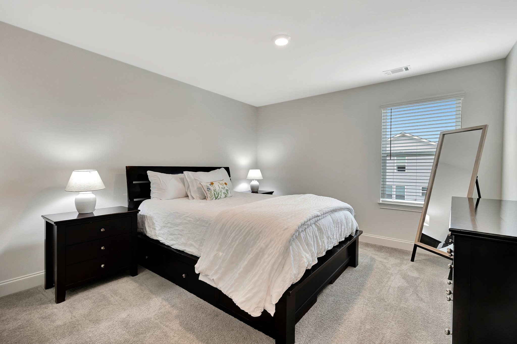3017 Shandor St Spring Hill Spring Hill, TN 37174 - Photo 27 of 46 a bedroom with a bed and lamp