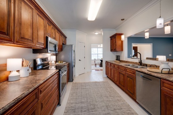 264 Fire Tower Road Dickson, TN 37055 - Photo 14 of 48 a large kitchen with stainless steel appliances granite countertop a stove a sink dishwasher and a refrigerator