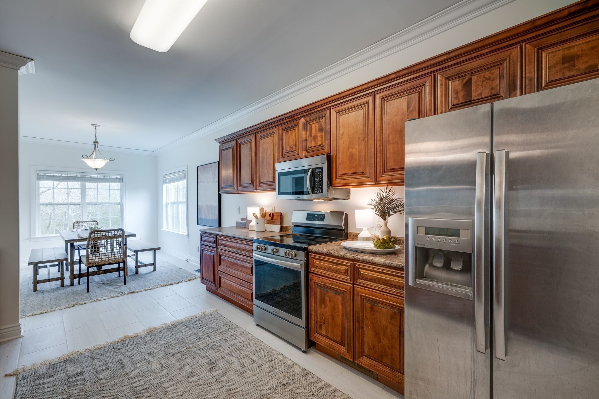 264 Fire Tower Road Dickson, TN 37055 - Photo 15 of 48 a kitchen with granite countertop stainless steel appliances and wooden cabinets