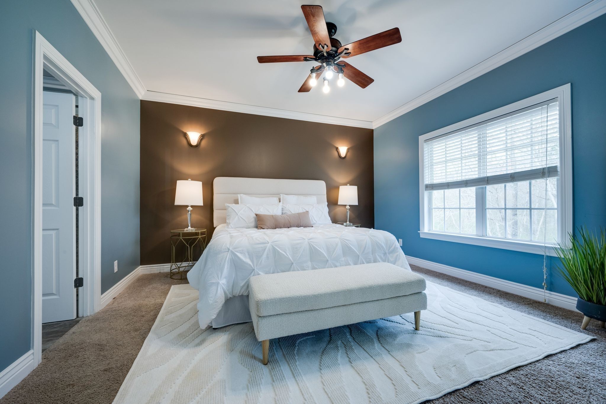 264 Fire Tower Road Dickson, TN 37055 - Photo 19 of 48 a bedroom with a large bed and a ceiling fan