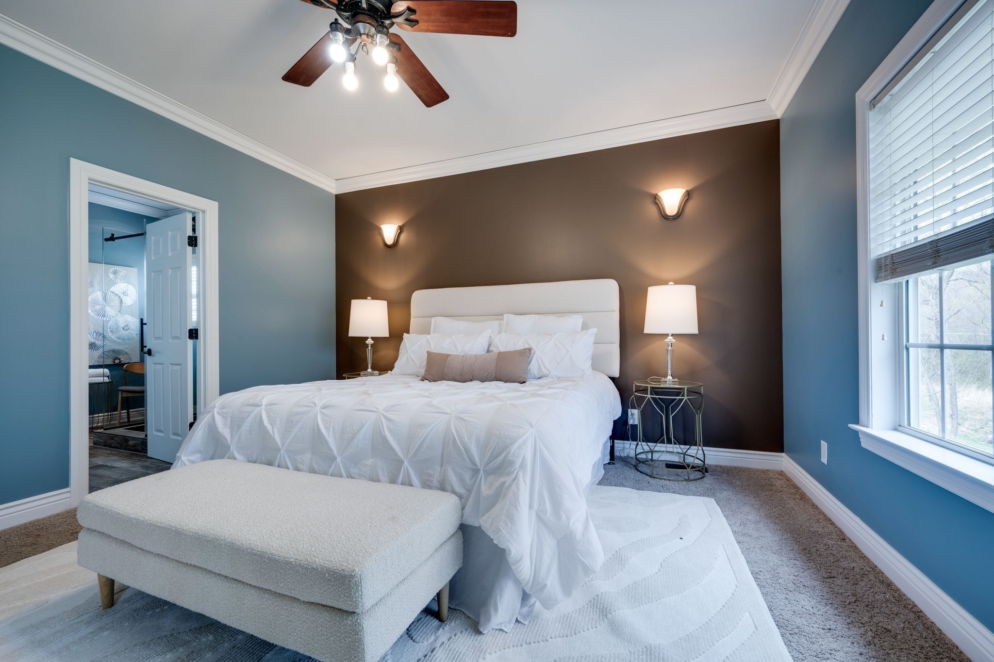 264 Fire Tower Road Dickson, TN 37055 - Photo 21 of 48 a bedroom with a large bed and a chandelier