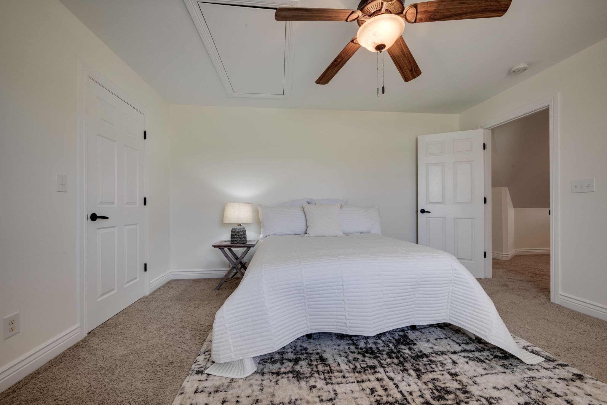 264 Fire Tower Road Dickson, TN 37055 - Photo 30 of 48 a bedroom with a bed and a chandelier