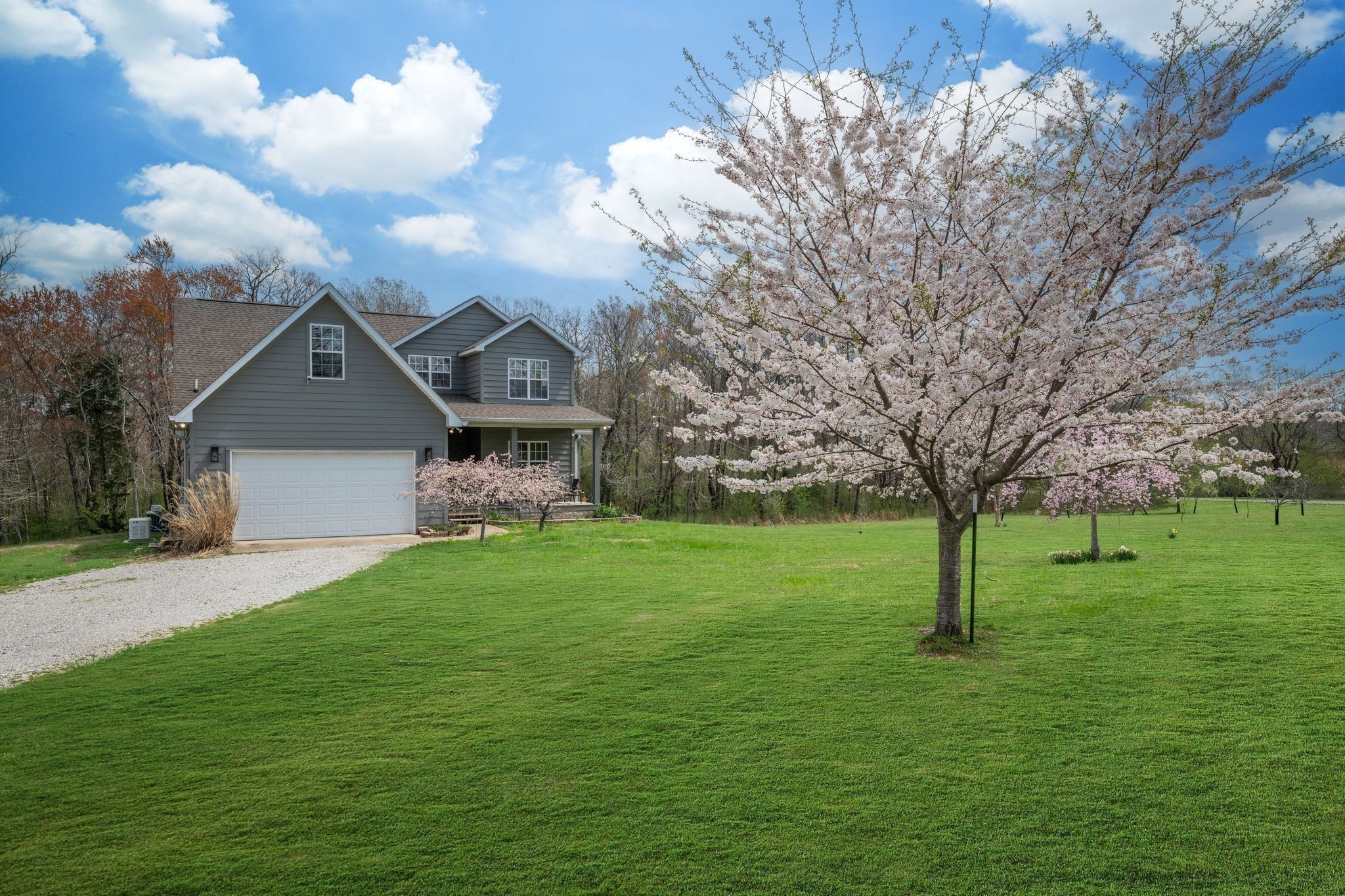 264 Fire Tower Road Dickson, TN 37055 - Photo 42 of 48 a front view of a house with garden