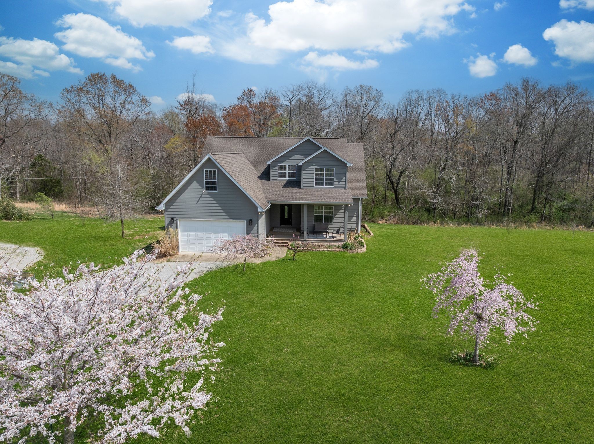 264 Fire Tower Road Dickson, TN 37055 - Photo 45 of 48 a front view of a house with garden