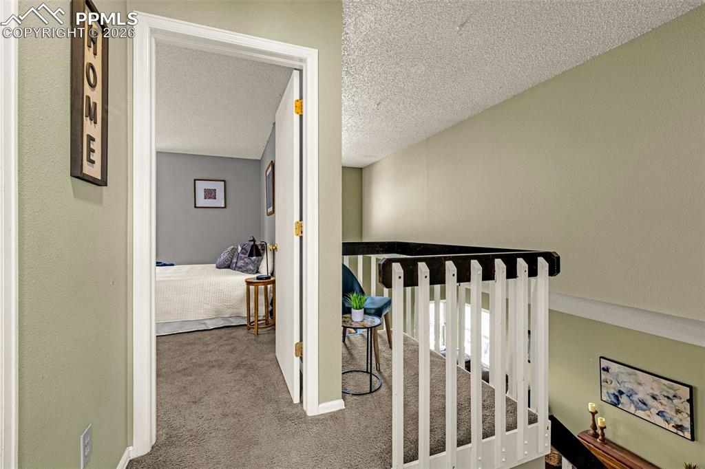 512 Harvest Moon Road Fountain, CO 80817 - Photo 12 of 41 a view of a bedroom from a hallway