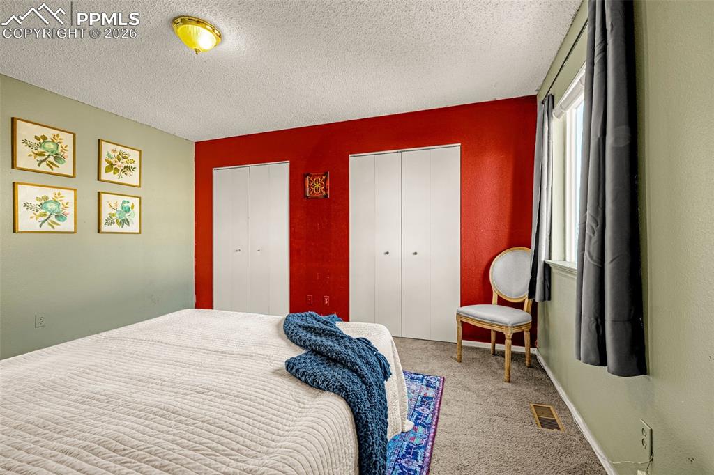 512 Harvest Moon Road Fountain, CO 80817 - Photo 14 of 41 a bedroom with bed and a window