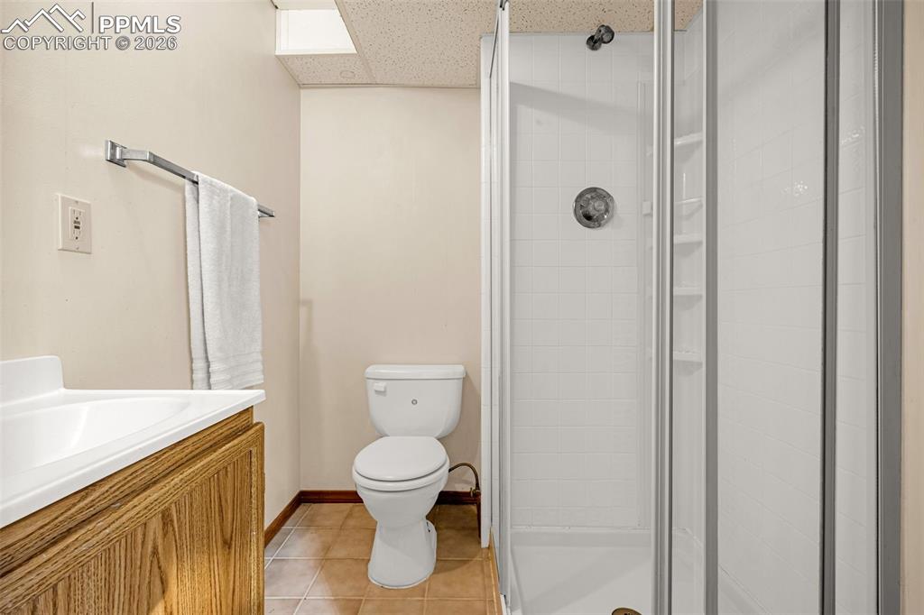 512 Harvest Moon Road Fountain, CO 80817 - Photo 26 of 41 a white toilet sitting next to a bathroom sink