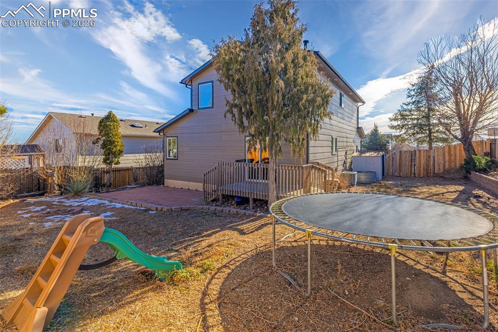 512 Harvest Moon Road Fountain, CO 80817 - Photo 29 of 41 a backyard of a house with fountain table and chairs