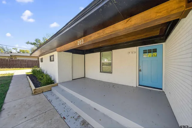 a view of backyard with large tree