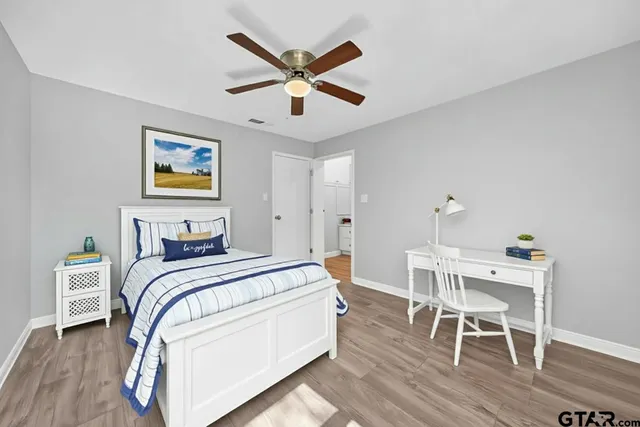 a bedroom with a bed and a table in it