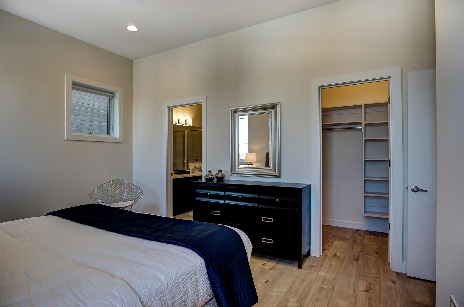 2532 West Addison Street, Unit 3E Chicago, IL 60618 - Photo 14 of 20 a bedroom with a bed and a dresser