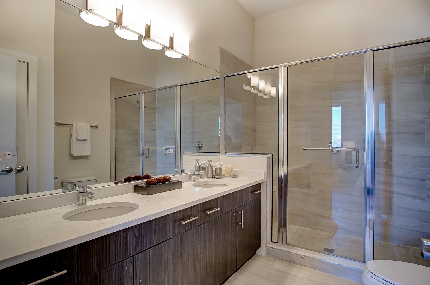 2532 West Addison Street, Unit 3E Chicago, IL 60618 - Photo 15 of 20 a bathroom with double sink and a mirror