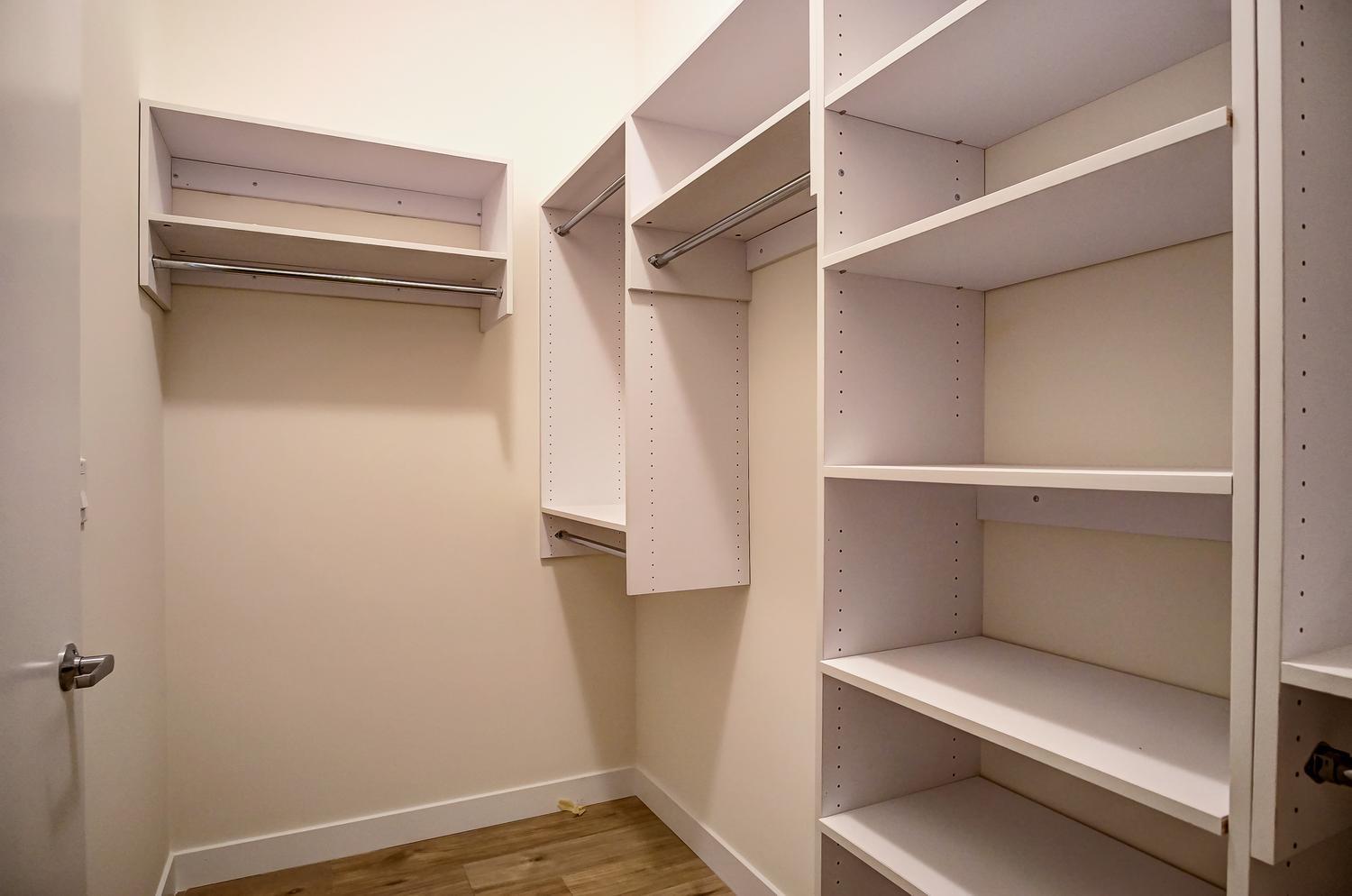 2532 West Addison Street, Unit 3E Chicago, IL 60618 - Photo 16 of 20 a view of walk in closet with empty racks