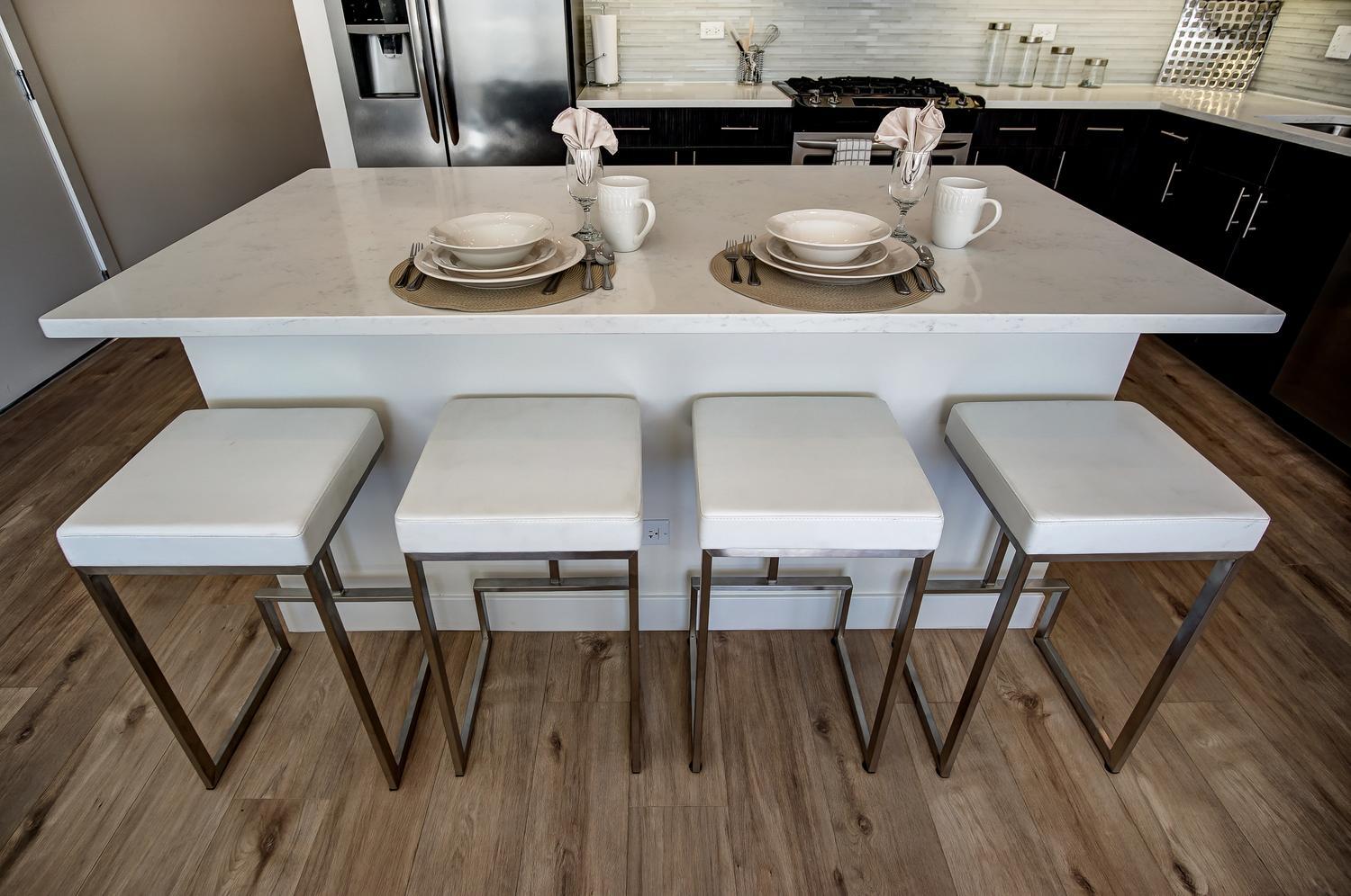 2532 West Addison Street, Unit 3E Chicago, IL 60618 - Photo 10 of 20 a dining room with two chairs and table
