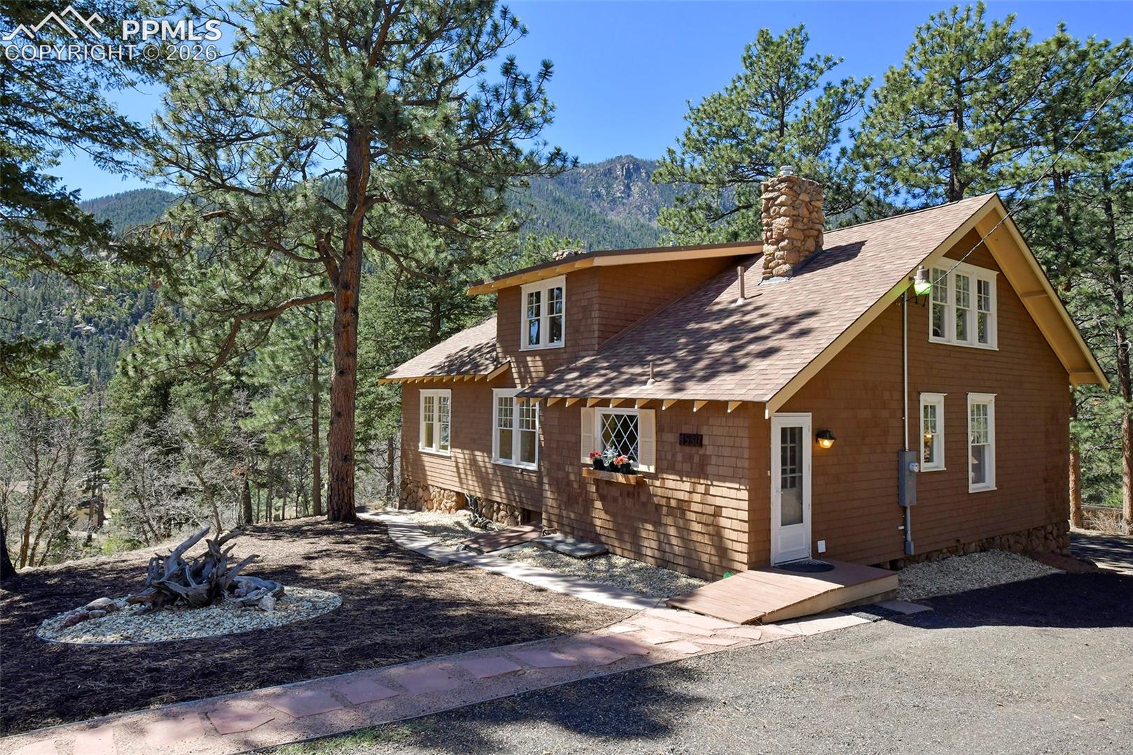 4530 Hagerman Road Cascade, CO 80809 - Photo 2 of 47 View Of Home Showing Side Entrance And Mountian Views