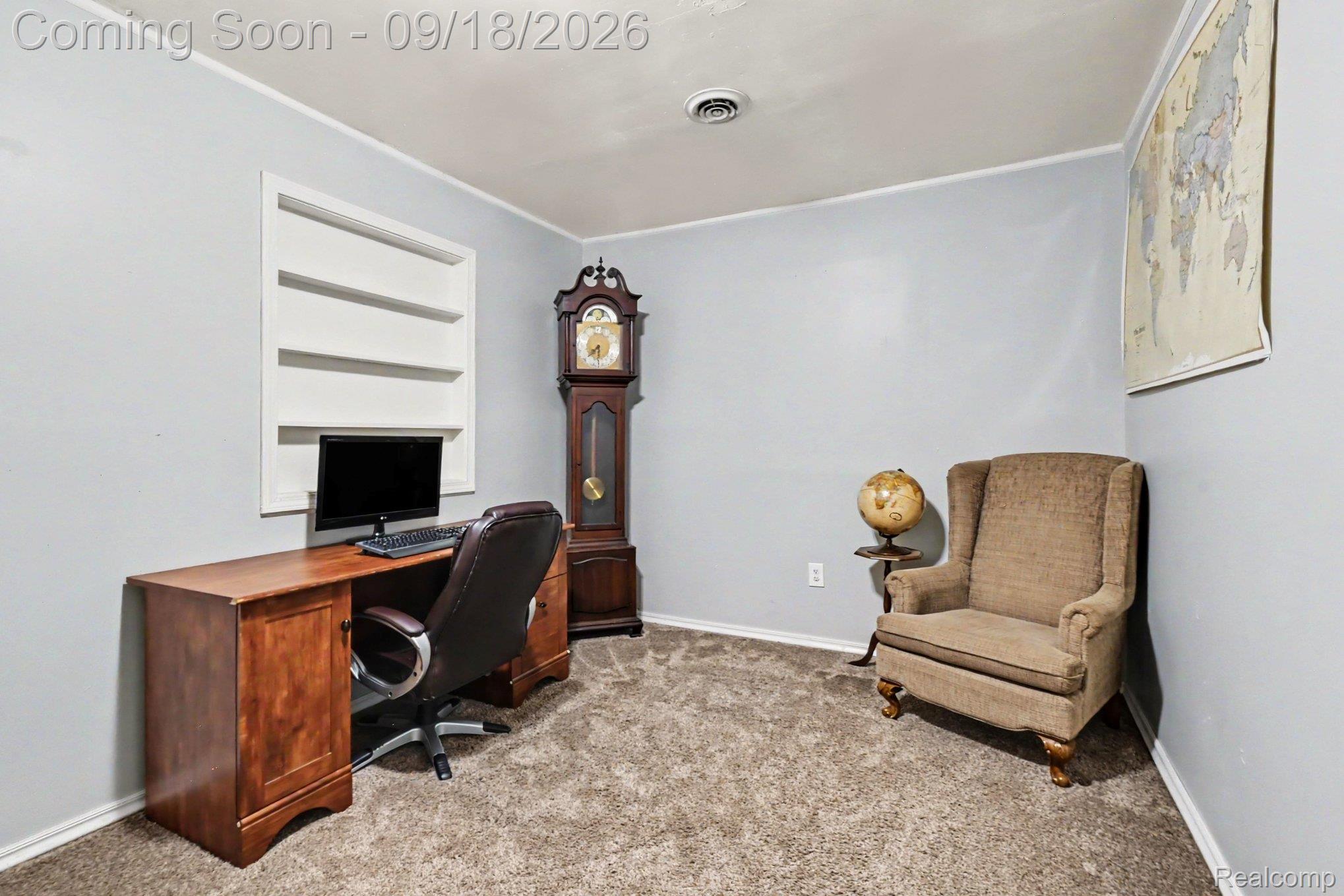 10755 Spencer Road St. Charles, MI 48655 - Photo 19 of 35 Built-in shelving unit, neutral wall paint, and carpeted flooring