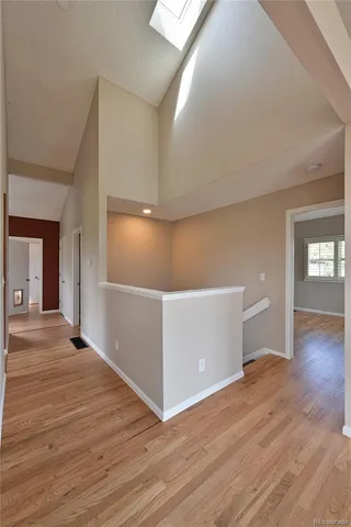 a view of a livingroom with wooden floor