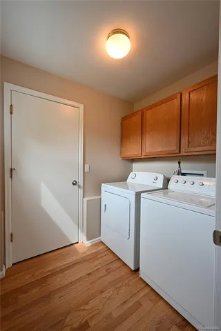 a room with a stove and a wooden floor