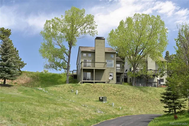 a view of house with yard