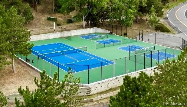 a view of a backyard with wooden fence