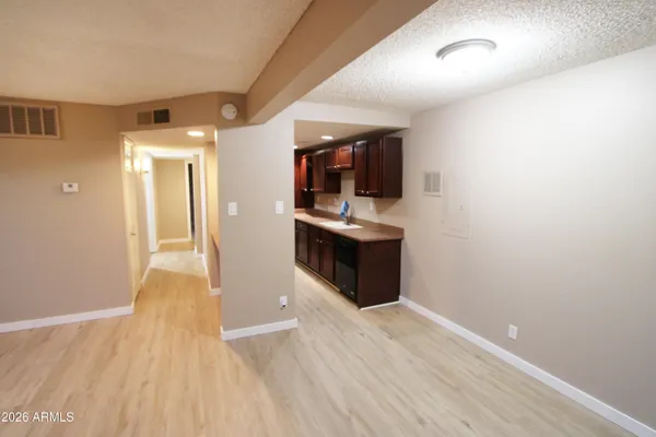 a view of a big room with a ceiling fan