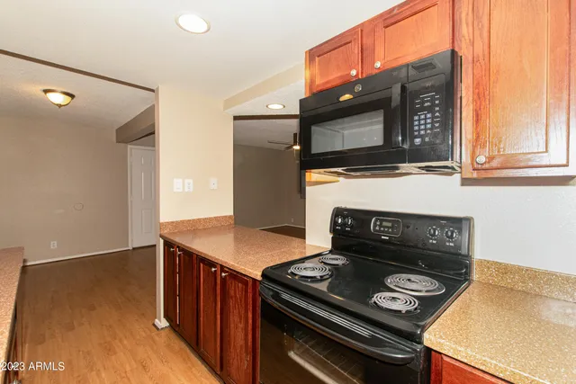 a kitchen with a stove and a microwave