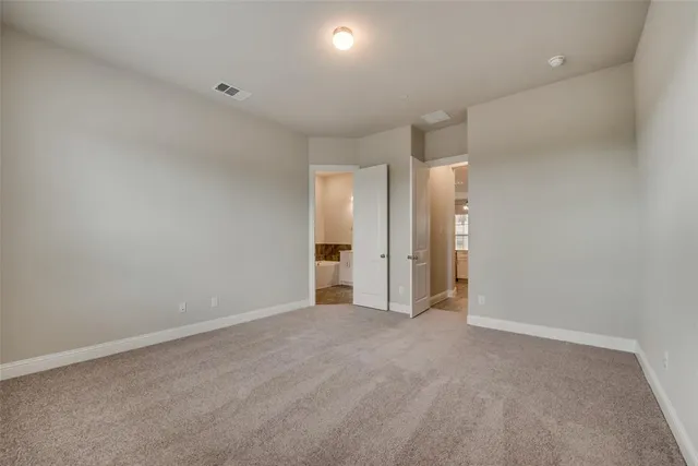 a bathroom with a tub sink shower and mirror