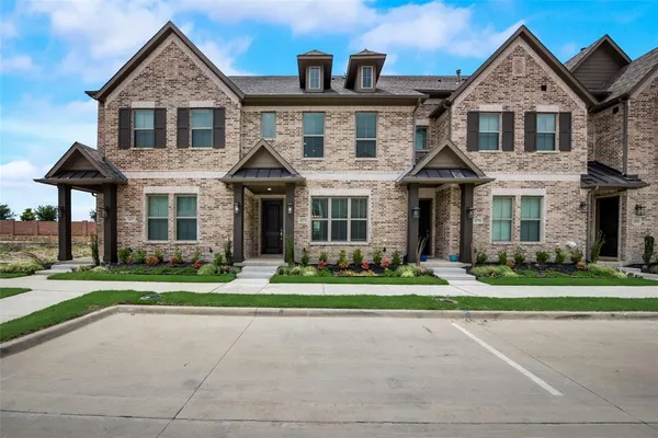 front view of a house and a yard