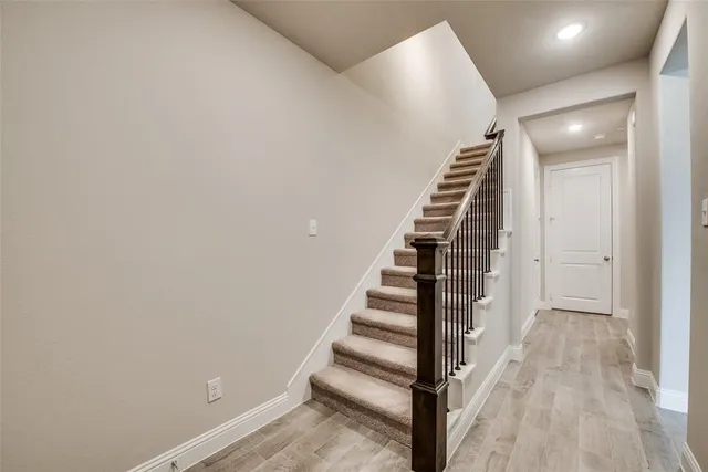 a view of entryway with wooden floor