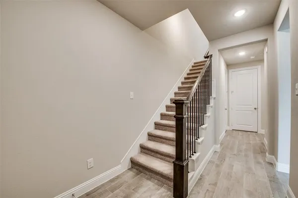 a view of entryway with wooden floor