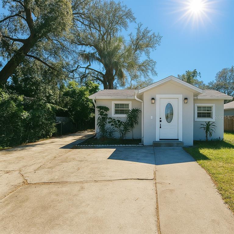 1310 West Burger Street Tampa, FL 33604 - Photo 1 of 14 a view of house with yard