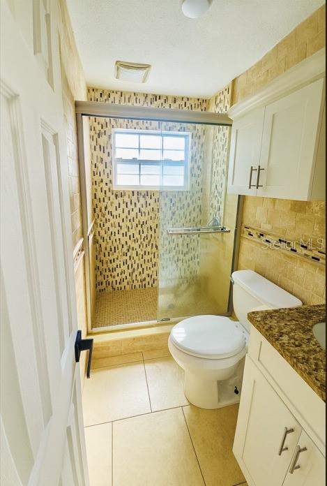 1310 West Burger Street Tampa, FL 33604 - Photo 14 of 14 a bathroom with a toilet and a shower